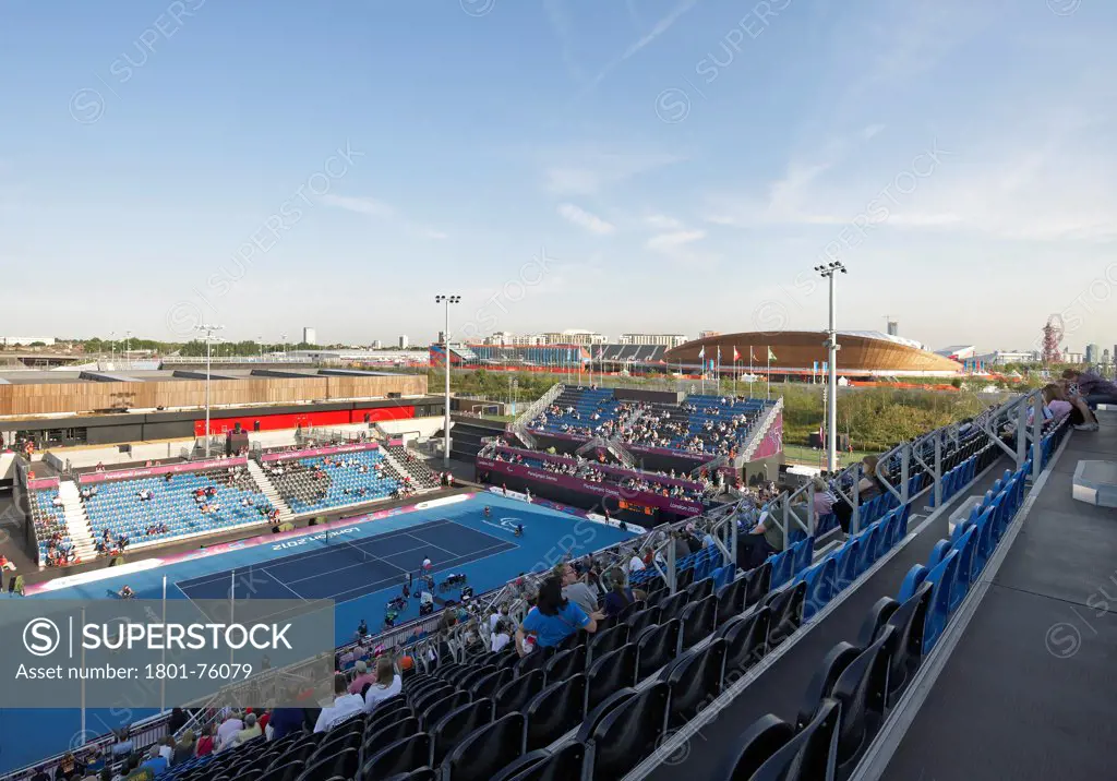 Eton Manor Olympic Park, London, United Kingdom. Architect: Stanton Williams, 2012. Elevated view to tennis court and Olympic Site environment.