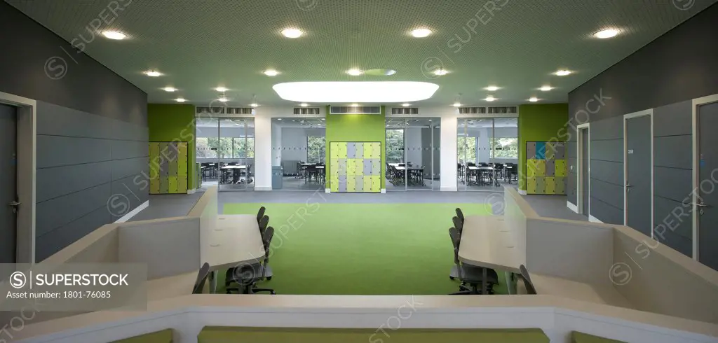 St Ambrose College, Altrincham, United Kingdom. Architect: Sheppard Robson, 2012. Hot desk area with view to glazed classrooms.