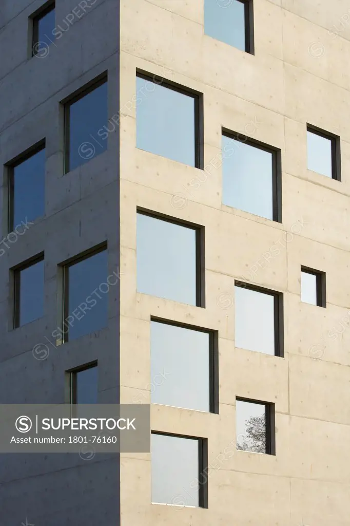 Zollverein School, Essen, Germany. Architect: SANAA Kazuyo Sejima + Ryue Nishizawa, 2006. Detail of concrete facade with windows.