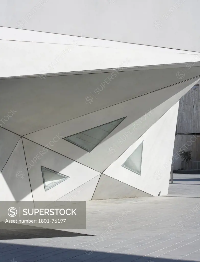 Tel Aviv Museum of Art, Tel Aviv, Israel. Architect: Preston Scott Cohen, 2011. Facade detail with triangular concrete slabs.