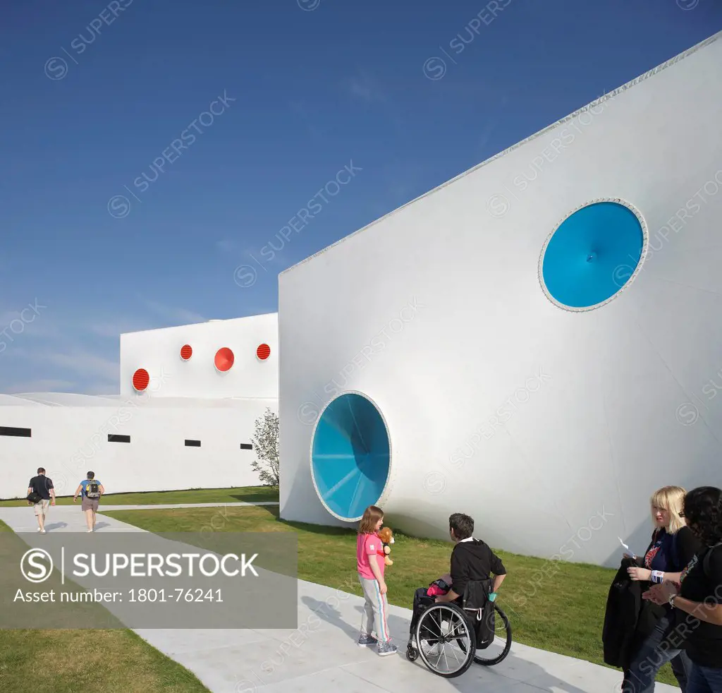 Olympic Shooting Ranges, London, United Kingdom. Architect: Magma Architecture, 2012. Exterior entry area of shooting ranges with visitors.