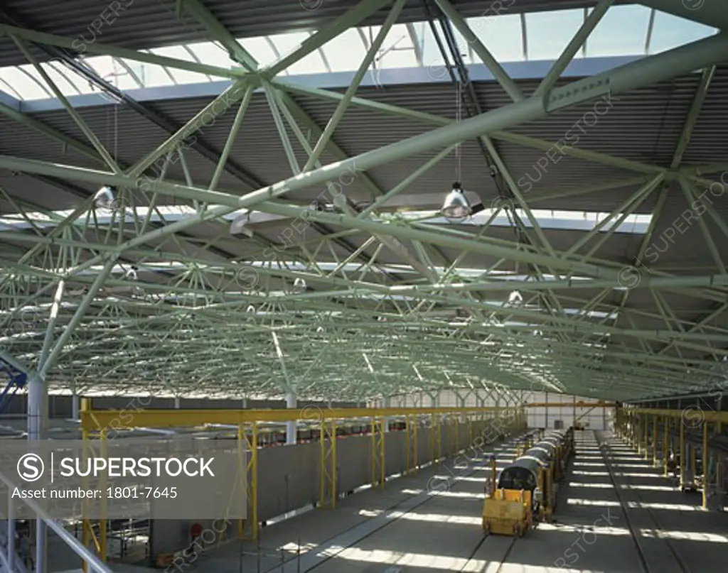 STRATFORD DEPOT, STRATFORD, LONDON, E15 STRATFORD, UNITED KINGDOM, INTERIOR OF SHED WITH NEW TRAIN AND YELLOW CLAMPS