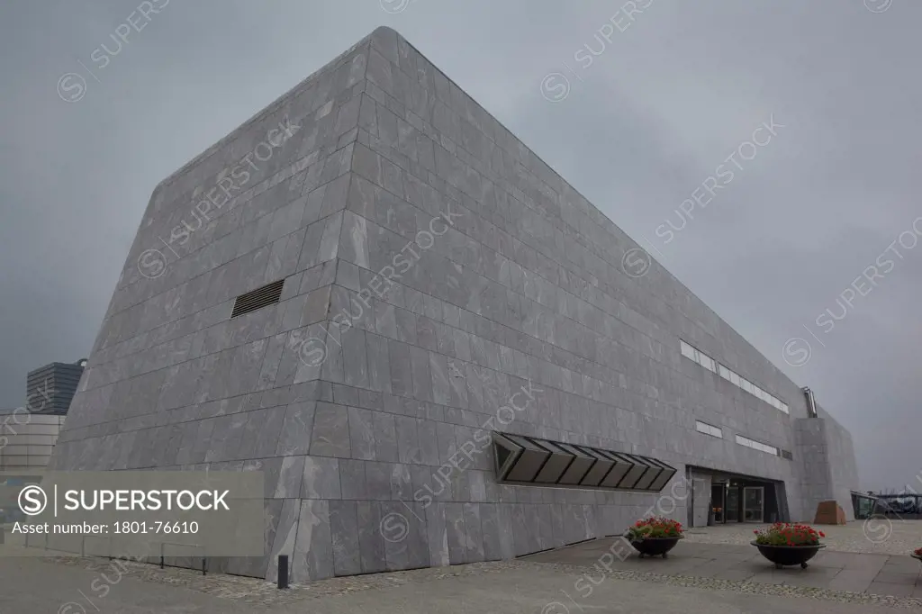 Main building, clad in dark grey Barents Blue gneiss, against rainy sky, Norwegian Petroleum Museum (Norsk Oljemuseum), Stavanger, Norway&#xA;Architects: Lunde & Løvseth Arkitekter (1999)