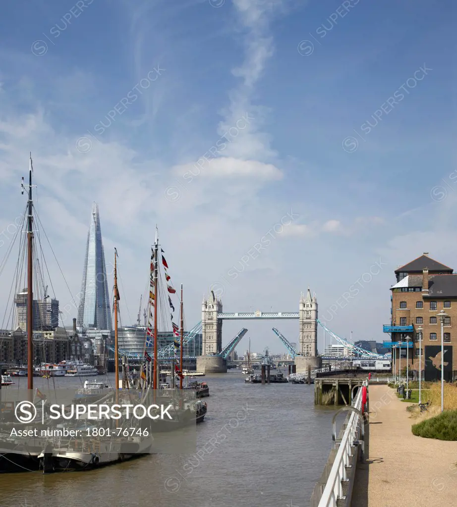 The SHARD, London, United Kingdom. Architect: Renzo Piano Building Workshop, 2012. Idyllic river scene from East with Tower Bridge raised.