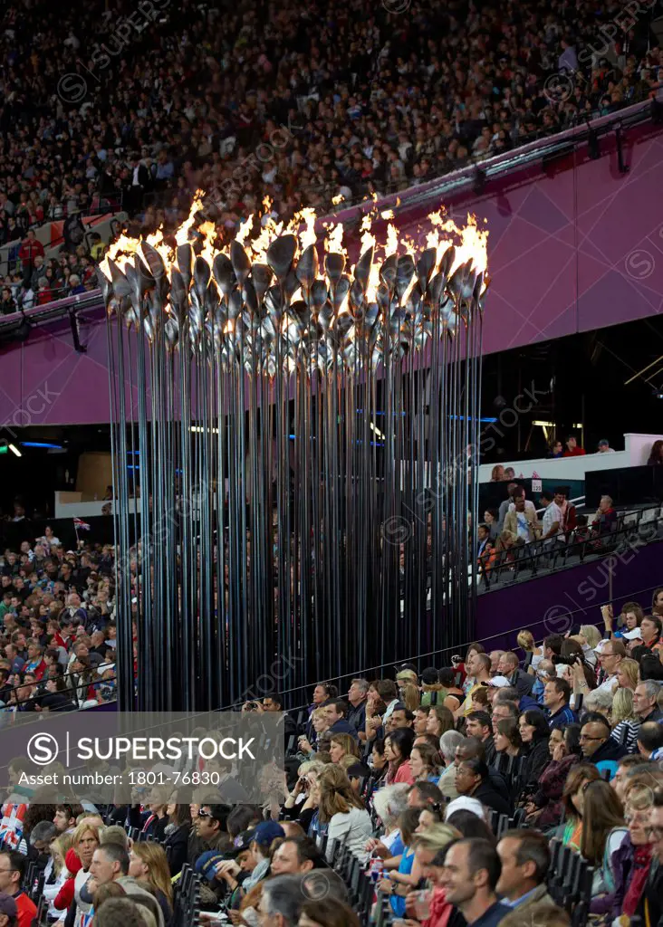 Olympic Cauldron, Art Installation, Europe, United Kingdom, , 2012, Heatherwick Studio. Side view showing cauldron with spectators.