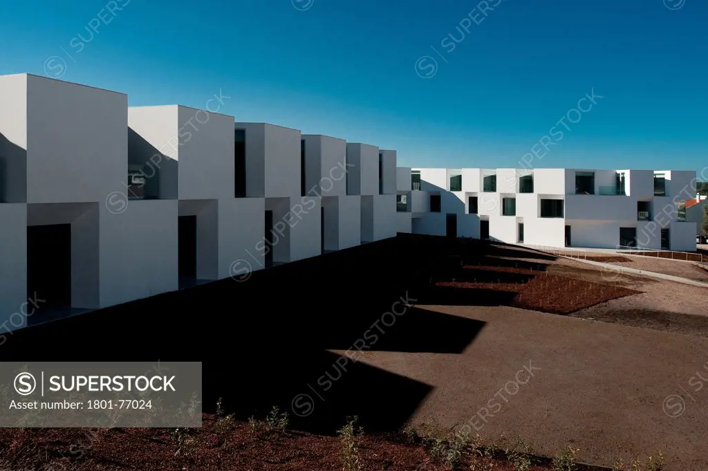 House for Elderly People, Alcaçer do Sal, Portugal. Architect: Francisco Aires Mateus Arquitectos, 2011. View of social housing complex in daylight.