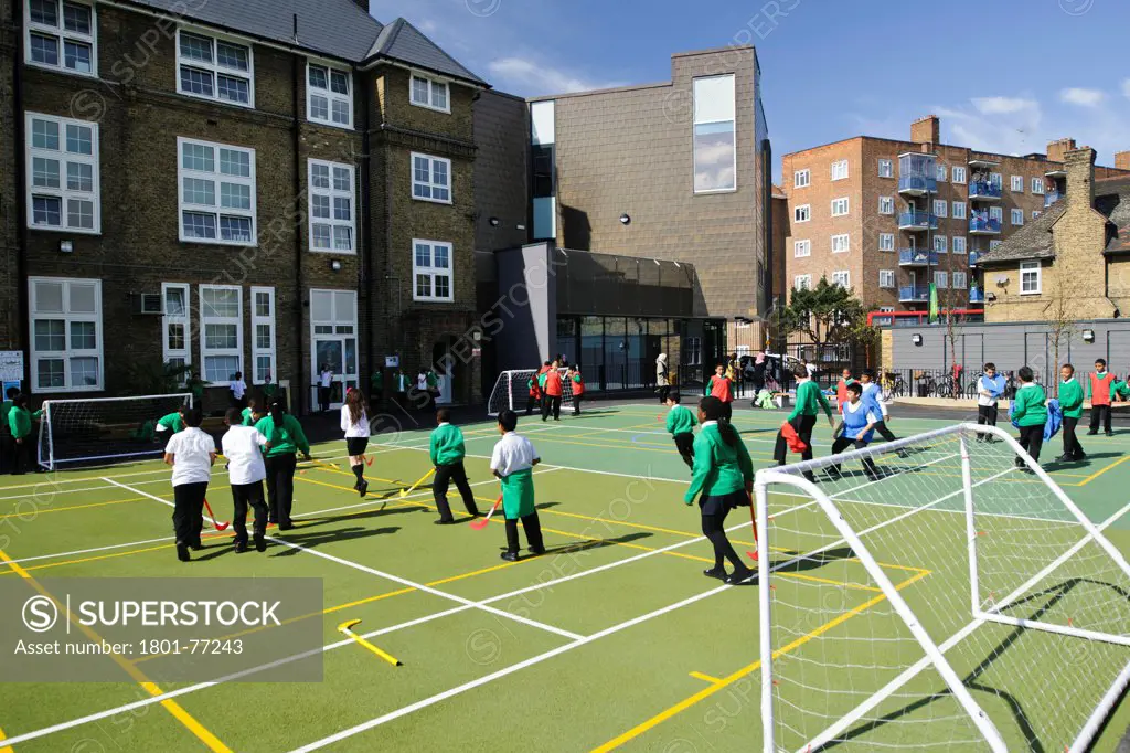 Orchard Primary School, Primary School, Europe, United Kingdom, , 2012, Rivington Street Studio. View of children in playground, reception entrance, new extension and existing buildings.