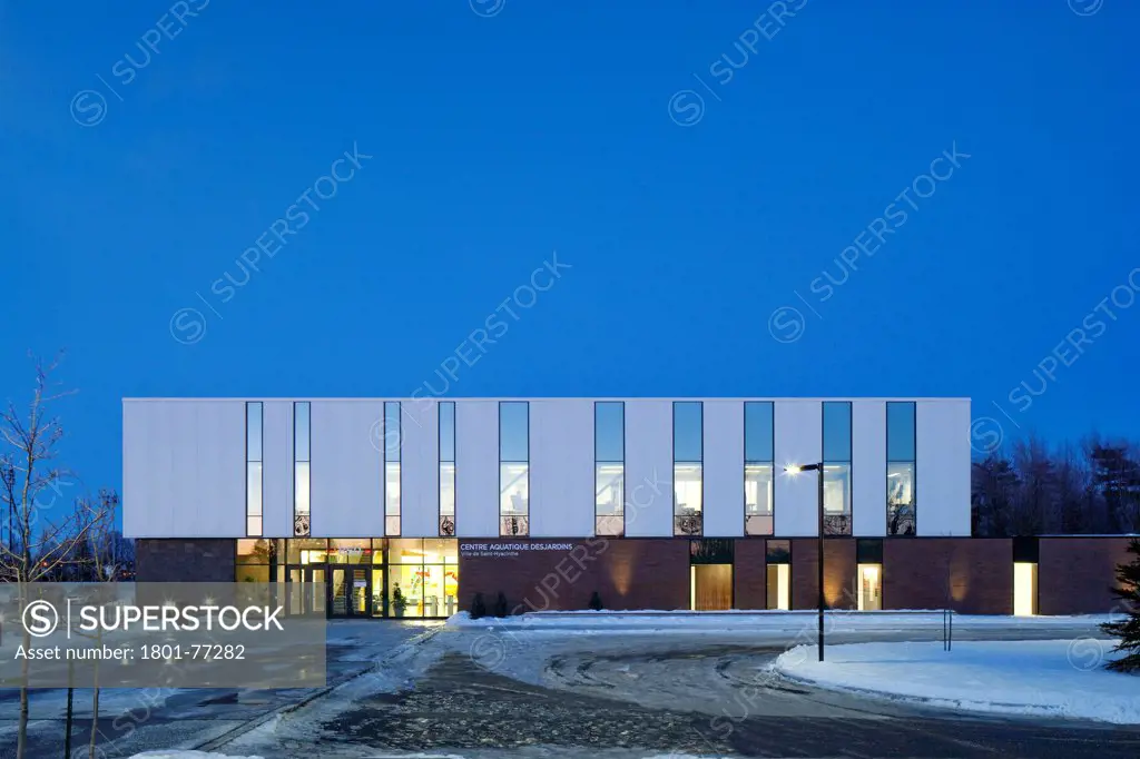 Centre Aquatique, St Hyacinthe, St Hyacinthe, Canada. Architect: Architecture, 2012. View of exterior main facade at dusk.