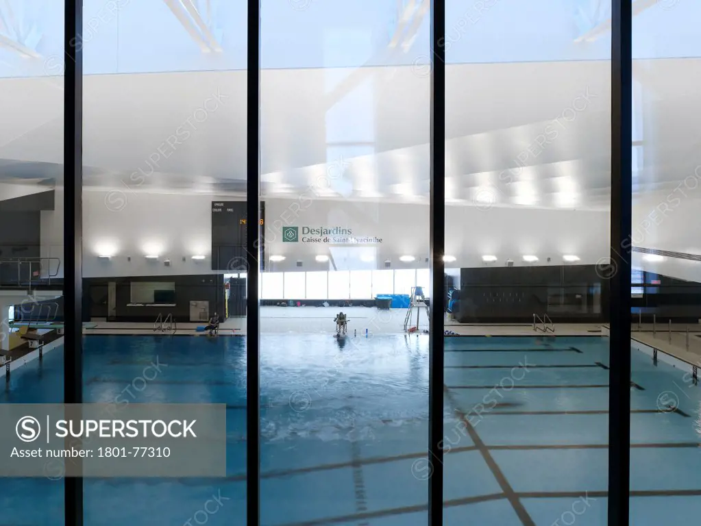 Centre Aquatique, St Hyacinthe, St Hyacinthe, Canada. Architect: Architecture, 2012. View into pool from gallery.