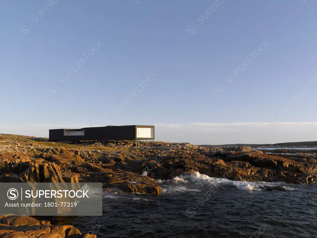 Long Studio, Fogo Island, Canada. Architect: Todd Saunders, 2011. Early morning view of Long Studio, from beach.