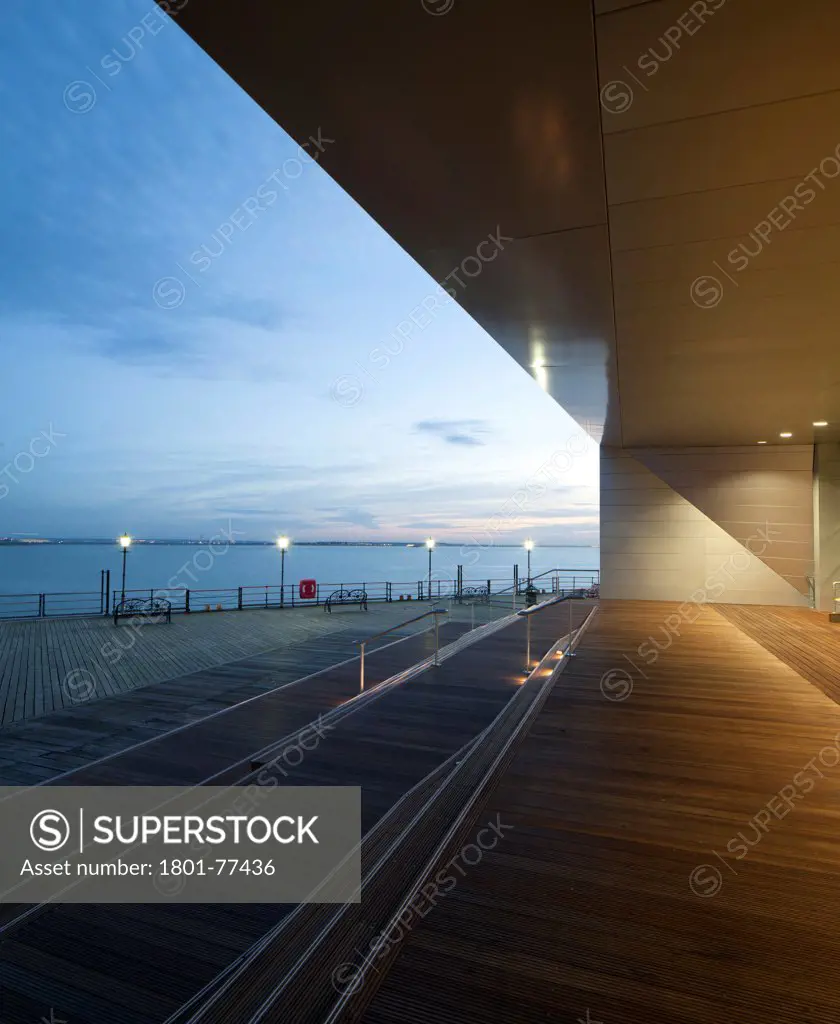Southend Pier Cultural Centre, Southend, United Kingdom. Architect: White Architects, 2012. Twilight exterior of the main entrance.
