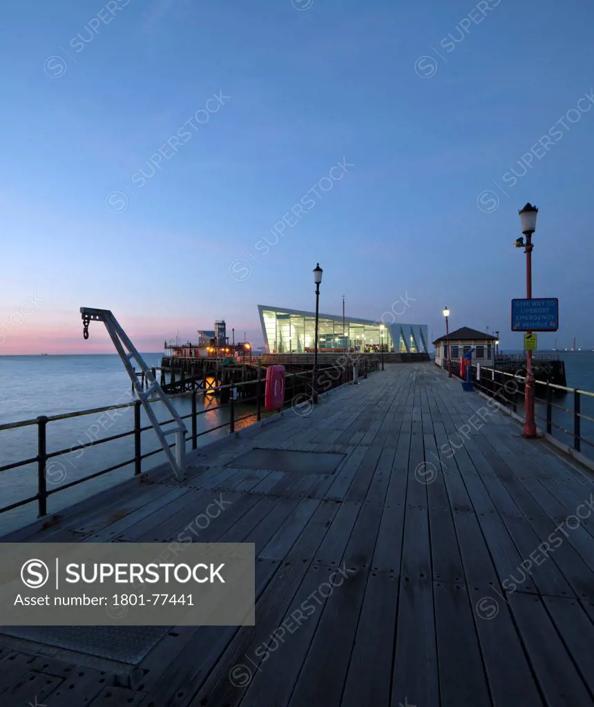 Southend Pier Cultural Centre, Southend, United Kingdom. Architect: White Architects, 2012. Sunrise of the centre looking south from the pier.