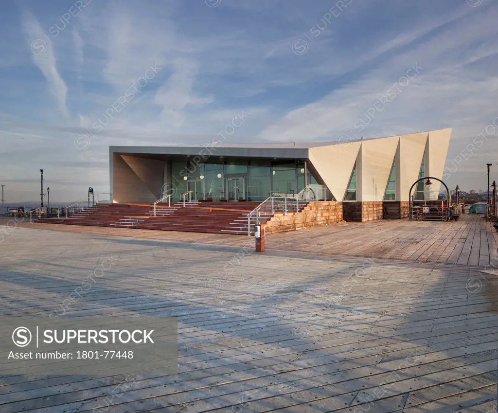 Southend Pier Cultural Centre, Southend, United Kingdom. Architect: White Architects, 2012. Main view of the centre at sunrise.