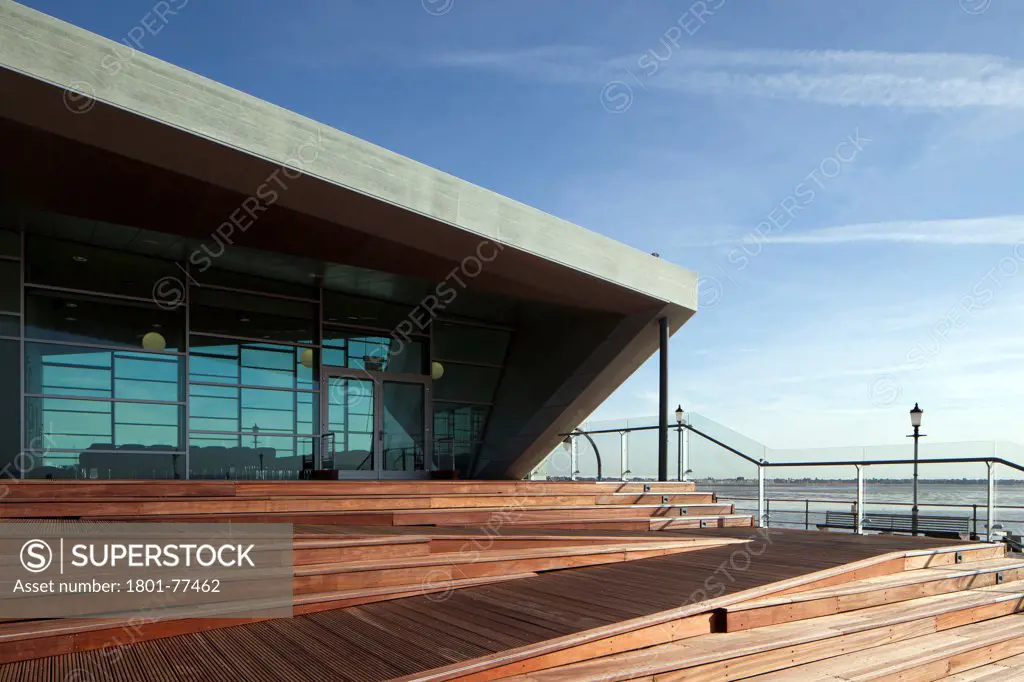Southend Pier Cultural Centre, Southend, United Kingdom. Architect: White Architects, 2012. Low sun hitting the wooden steps leading up to the main entrance.