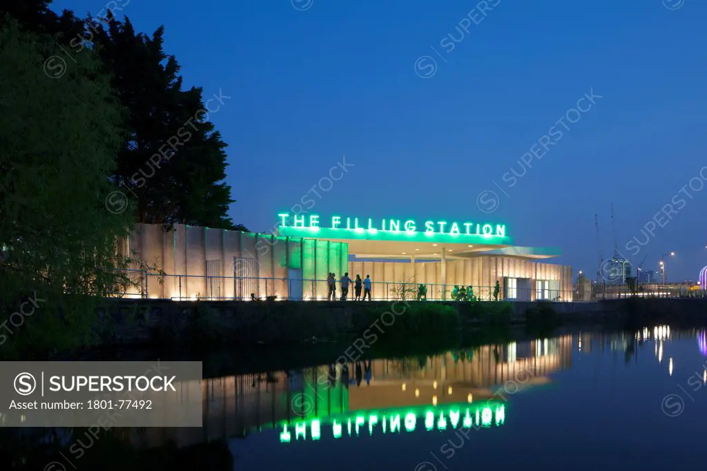 The Filling Station, London, United Kingdom. Architect: Carmody Groarke, 2012. Night time exterior looking across the Regents Canal.
