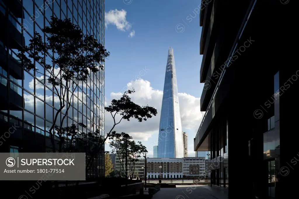 The Shard, London, United Kingdom. Architect: RENZO PIANO , 2012. Square view framed by offices from north bank of thames.