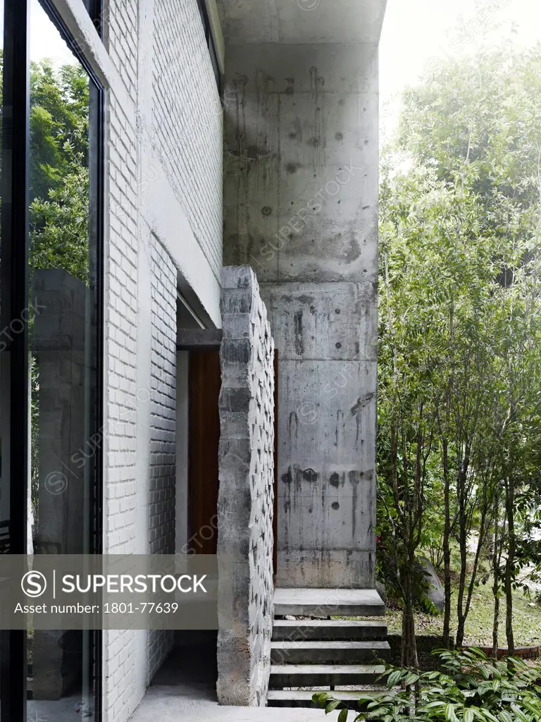 Dog Concrete House, Kuala Lumpur, Malaysia. Architect: Kevin Low, 2012. View of entrance from upper walkway.