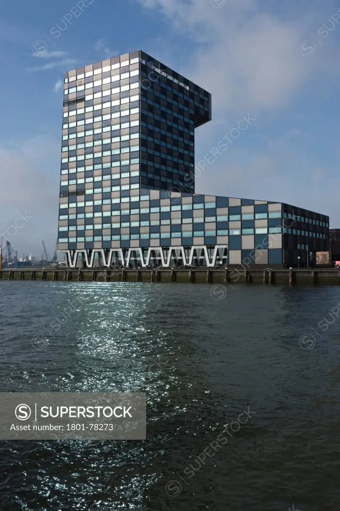 Scheepvaart en Transport College, Rotterdam, Netherlands. Architect: Neutelings Riedijk, 2005. General exterior view with River Maas in foreground.