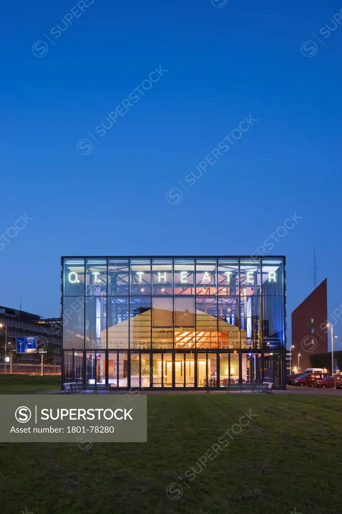 O.T. Theatre, Rotterdam, Netherlands. Architect: Franz Ziegler, 2004. Exterior at dusk,.