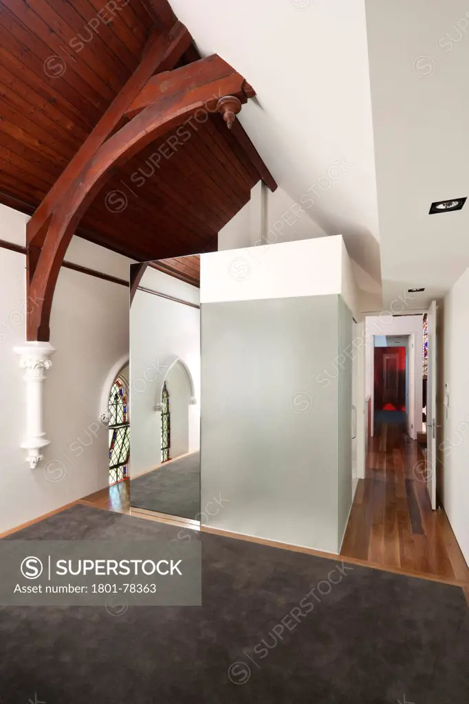 John Knox Church Conversion, Melbourne, Australia. Architect: Williams Boag Architects, 2010. Bedroom featuring ensuite/bathroom volume.