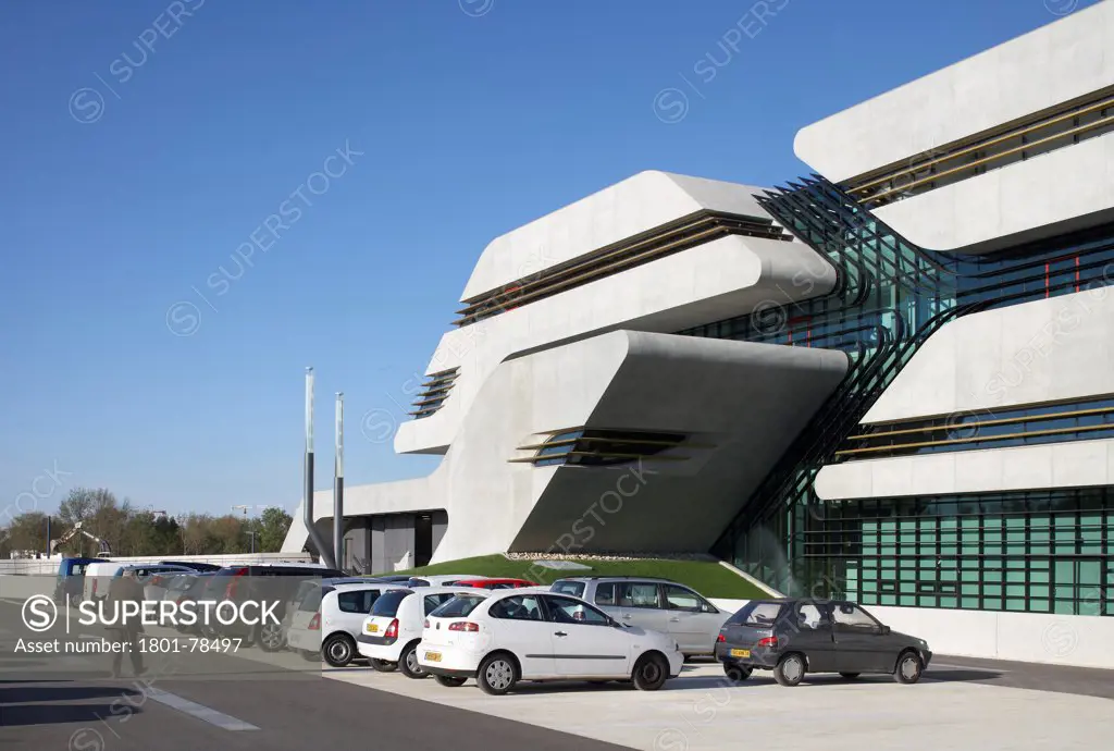 Pierresvives Building, Montpellier, France. Architect: Zaha Hadid Architects, 2012. Detail Of Chamfered Concrete Facade And Visitor Car Park.