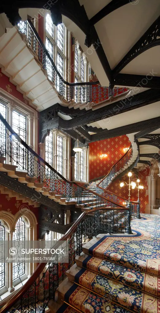 St Pancras Hotel, London, United Kingdom. Architect: Sir Giles Gilbert Scott With Richard Griffiths Arc, 2011. Vertical Panorama Of Grand Three-Story High Double Staircase.