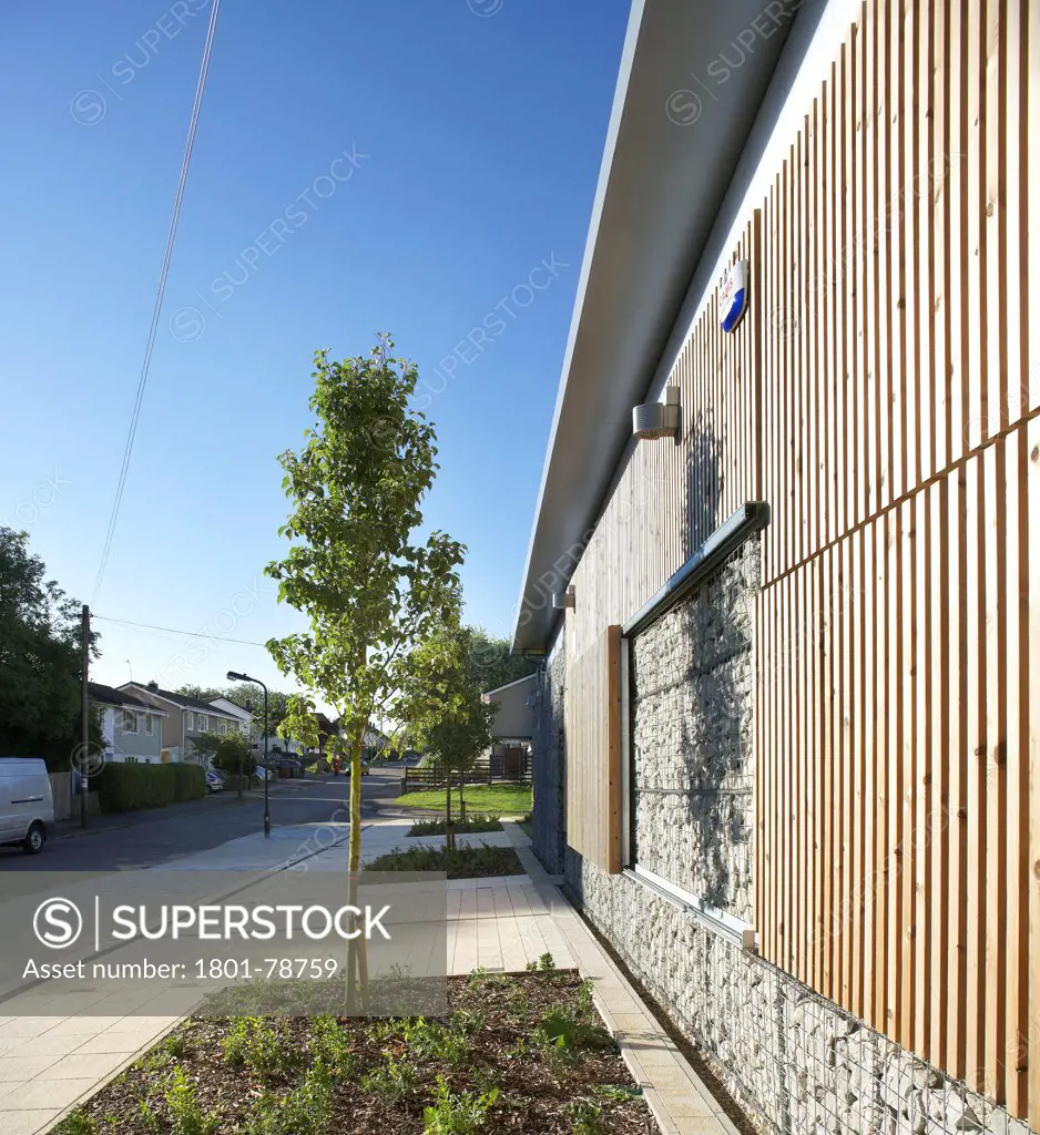 Cedars Youth And Community Centre, Harrow, United Kingdom. Architect: Lom Architecture And Design, 2012. Perspective Of Timber Cladding, Timber Shutters And Gabions.