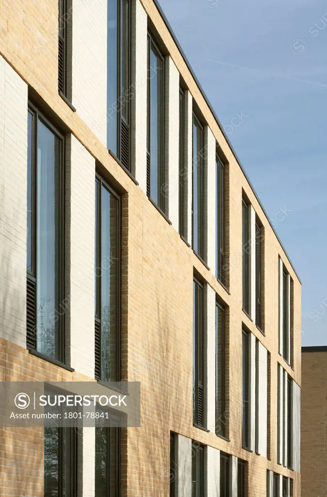 Thomas Tallis School, Greenwich, United Kingdom. Architect: John Mcaslan & Partners, 2012. Perspective Of Three-Storey, Brick Clad Facade With Window Line Up.