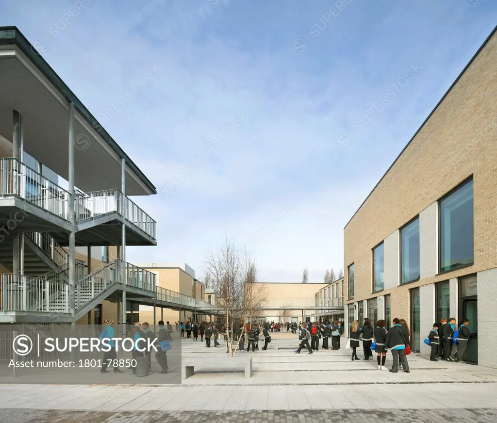 Thomas Tallis School, Greenwich, United Kingdom. Architect: John Mcaslan & Partners, 2012. View Through Concourse With Educational Buildings.