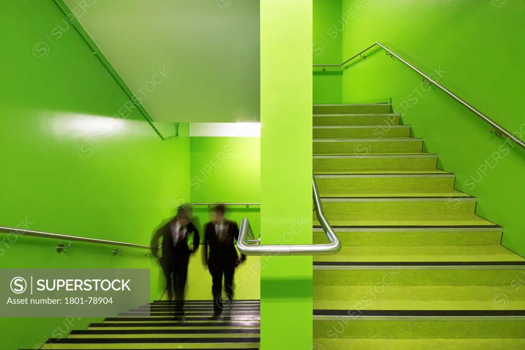 Rsa Academy, Tipton, United Kingdom. Architect: John Mcaslan & Partners, 2011. Bright Green Staircase With Students In Motion.