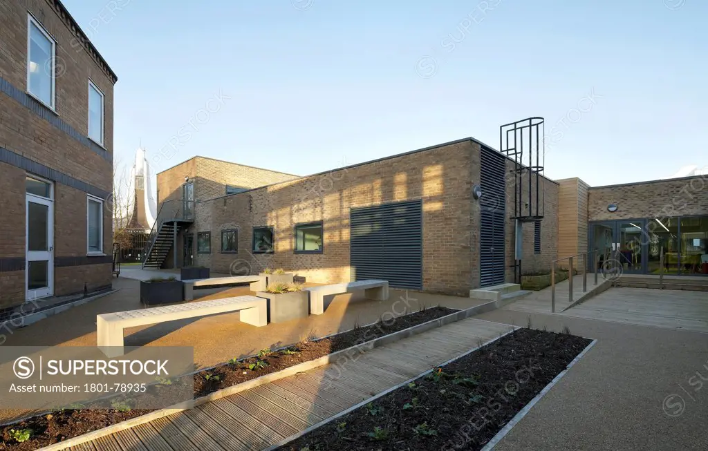 Lancaster University Human Resources Centre, Lancaster, United Kingdom. Architect: John Mcaslan & Partners, 2012. Brick Facades And Landscaped Entrance With Ramp.