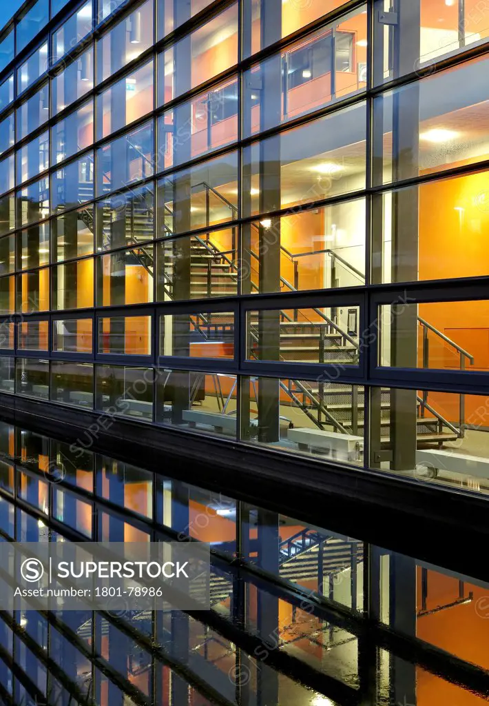 Postgraduate Statistics Centre And Learning Zone Building Lancaster University, Lancaster, United Kingdom. Architect: John Mcaslan & Partners, 2011. Glazing Detail At Night.