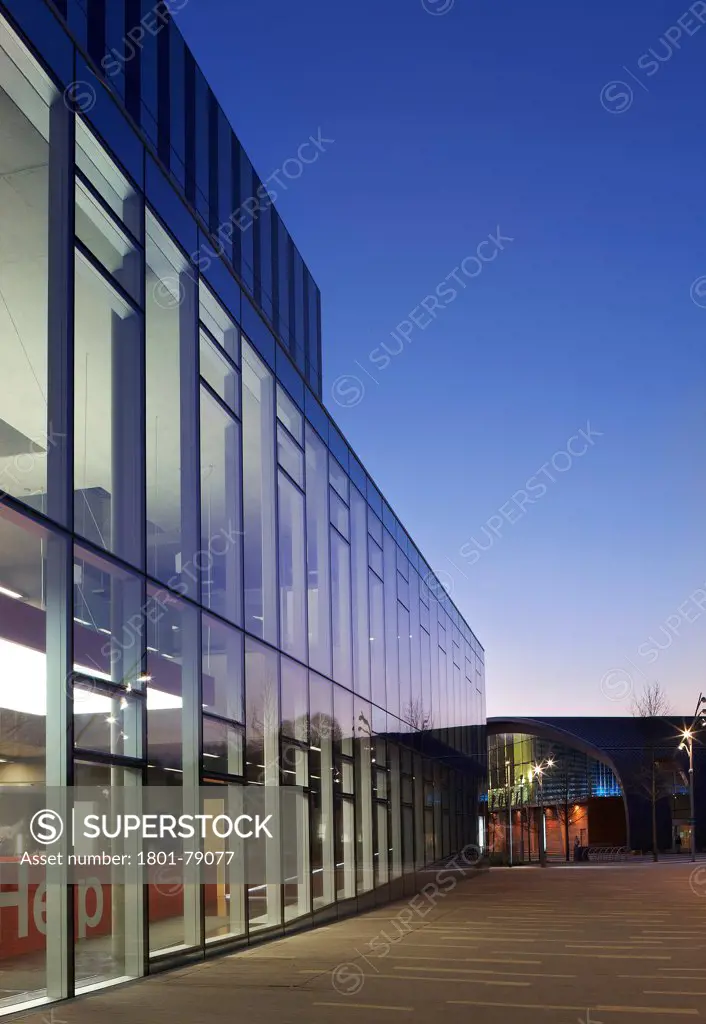 Corby Cube, Corby, United Kingdom. Architect: Hawkins Brown Architects Llp, 2010. Dusk View Along Glazed Protruding Entrance.