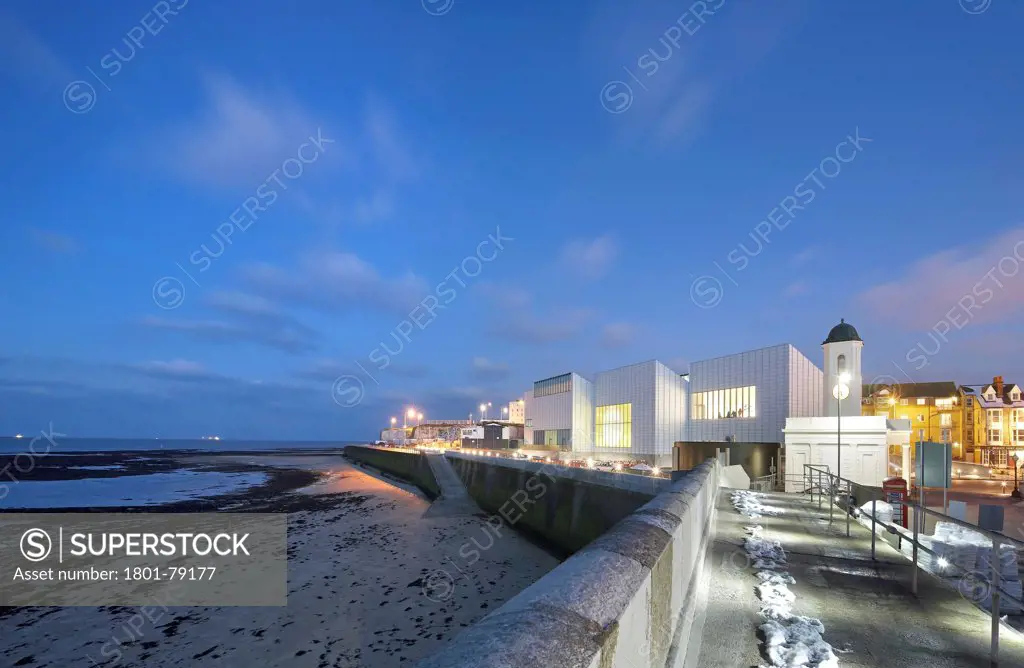 Turner Contemporary Gallery, Margate, United Kingdom. Architect: David Chipperfield Architects Ltd, 2011. View Along Old Pier Wall To Gallery And Context At Dusk.