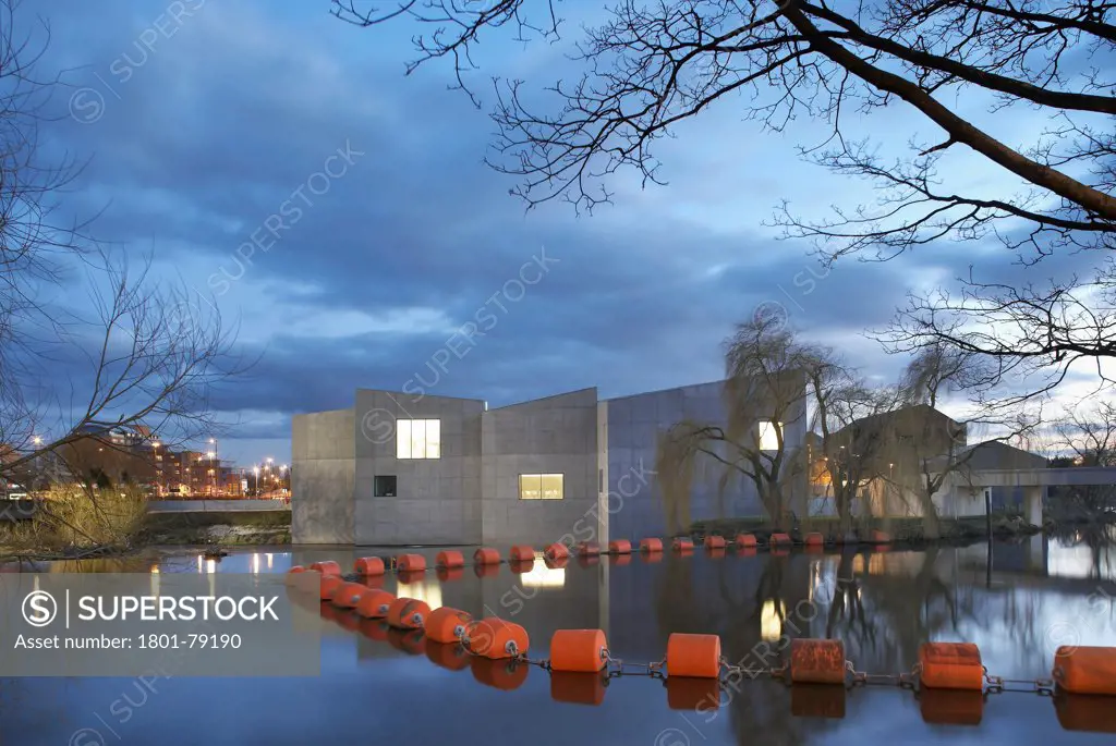 The Hepworth Wakefield, Margate, United Kingdom. Architect: David Chipperfield Architects Ltd, 2011. Idyllic View Across River Calder To Gallery In Context.