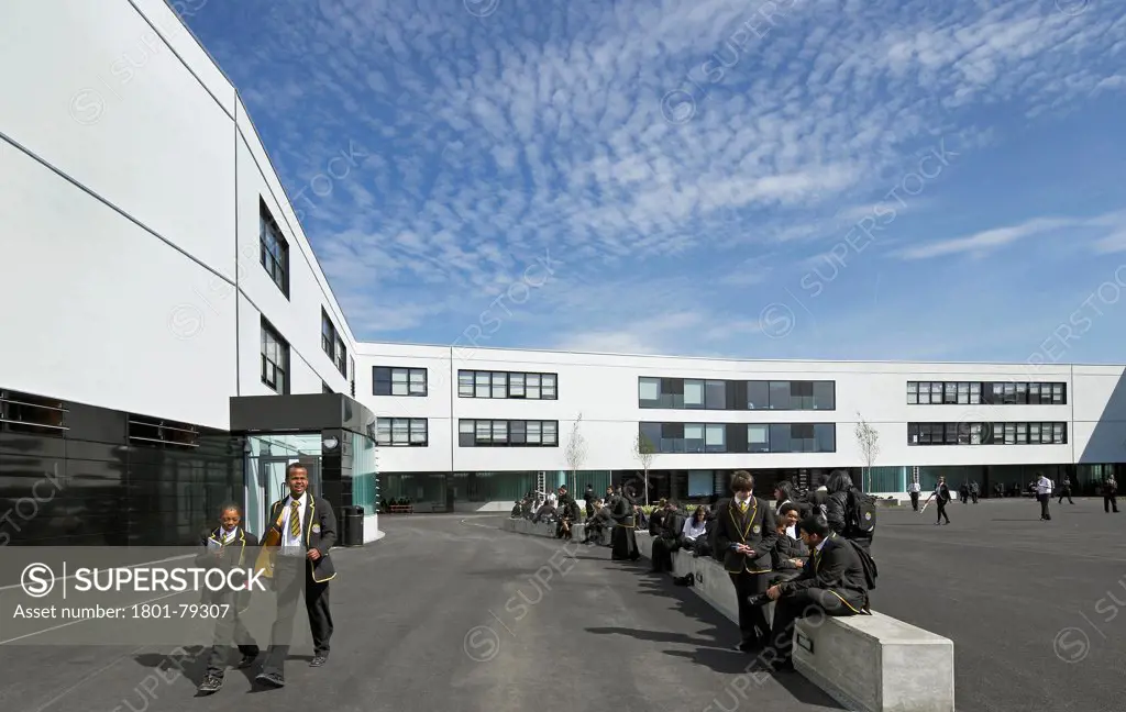Globe Academy, London, United Kingdom. Architect: Amanda Levete Architects, 2011. Three-Storey Teaching Block, Schoolyard And Students.