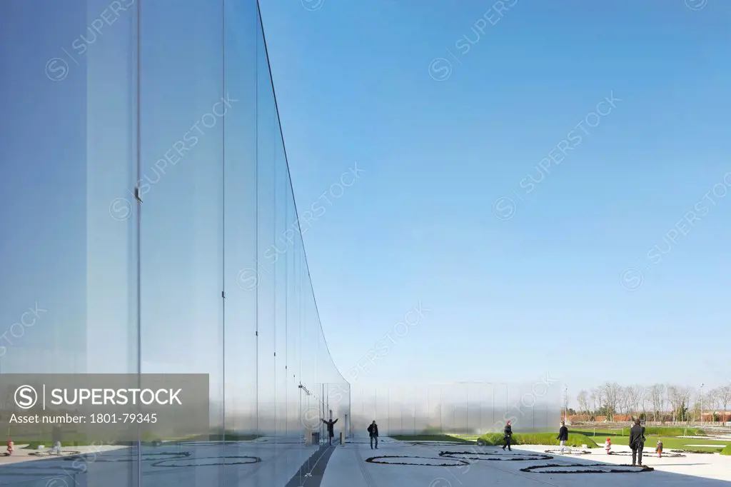 Musée Du Louvre  Lens, Lens, France. Architect: Sanaa, 2012. Perspective Of Subtly Curved Exterior Glazing With Reflection.