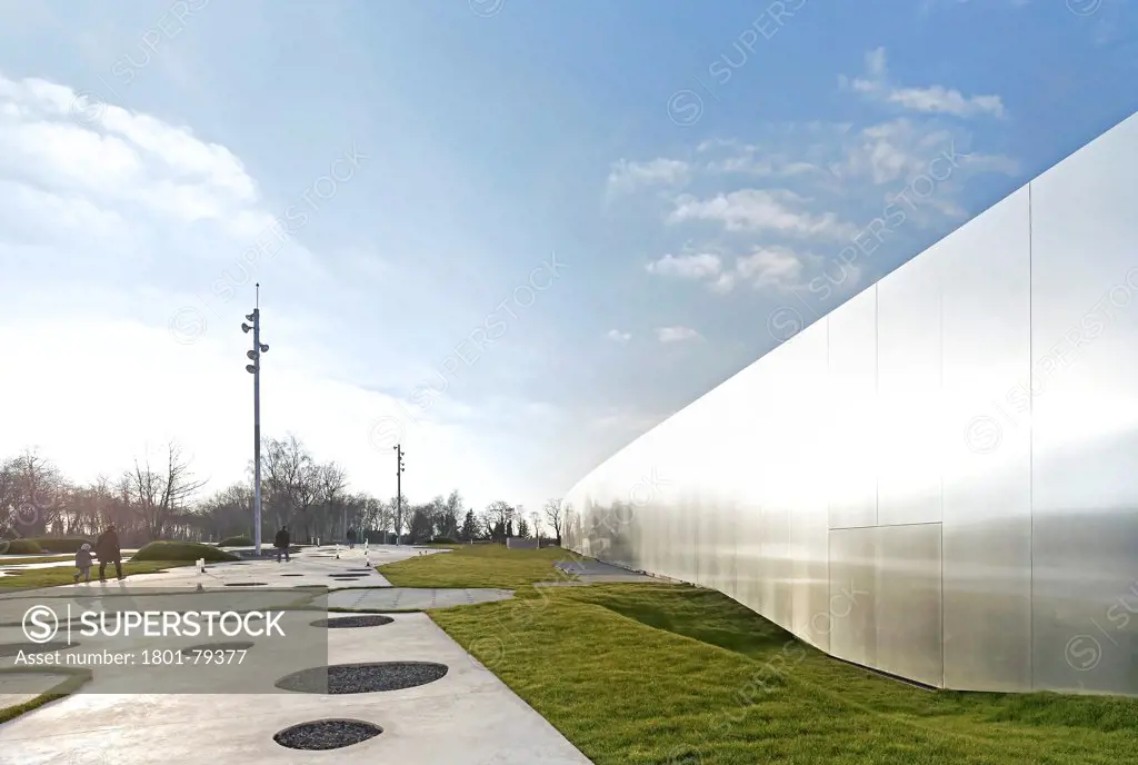 Musée Du Louvre  Lens, Lens, France. Architect: Sanaa, 2012. Exterior Elevation With Alternate Lawn And Concrete Surface And Building Facade In Perspective.