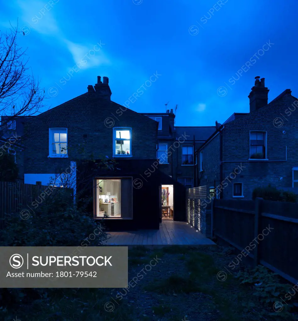 Victoria Road Private Home, London, United Kingdom. Architect: Ob-A, 2012. Comprehensive External View Of Rear Extension At Night.