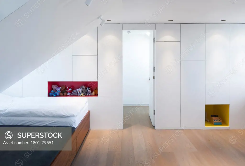 Highbury Loft Conversion, London, United Kingdom. Architect: Azman Architects, 2012. View Of Entrance From Stair With Cabinetry And Childrens Toys.