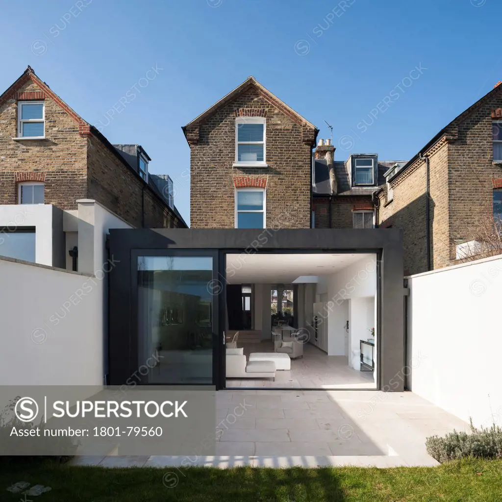 Homefield Road, London, United Kingdom. Architect: De Matos Ryan, 2012. External View Of Extension In Context Of Terrace.