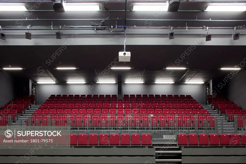 Sidney Stringer Academy, Coventry, Coventry, United Kingdom. Architect: Sheppard Robson , 2012. Red Coloured Seating In Auditorium.