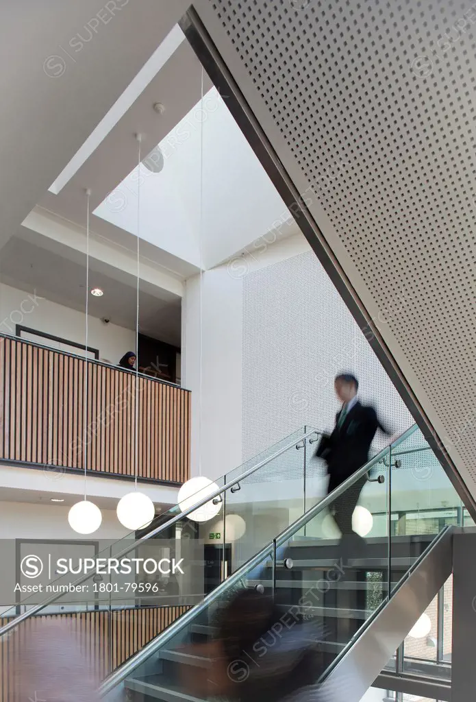 Sidney Stringer Academy, Coventry, Coventry, United Kingdom. Architect: Sheppard Robson , 2012. Student On Staircase.