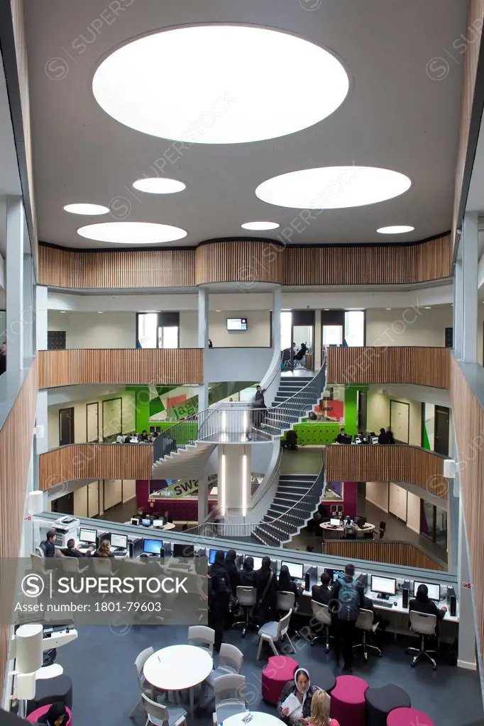Sidney Stringer Academy, Coventry, Coventry, United Kingdom. Architect: Sheppard Robson , 2012. Comprehensive View Through Atrium With Staircase And It Work Spaces.
