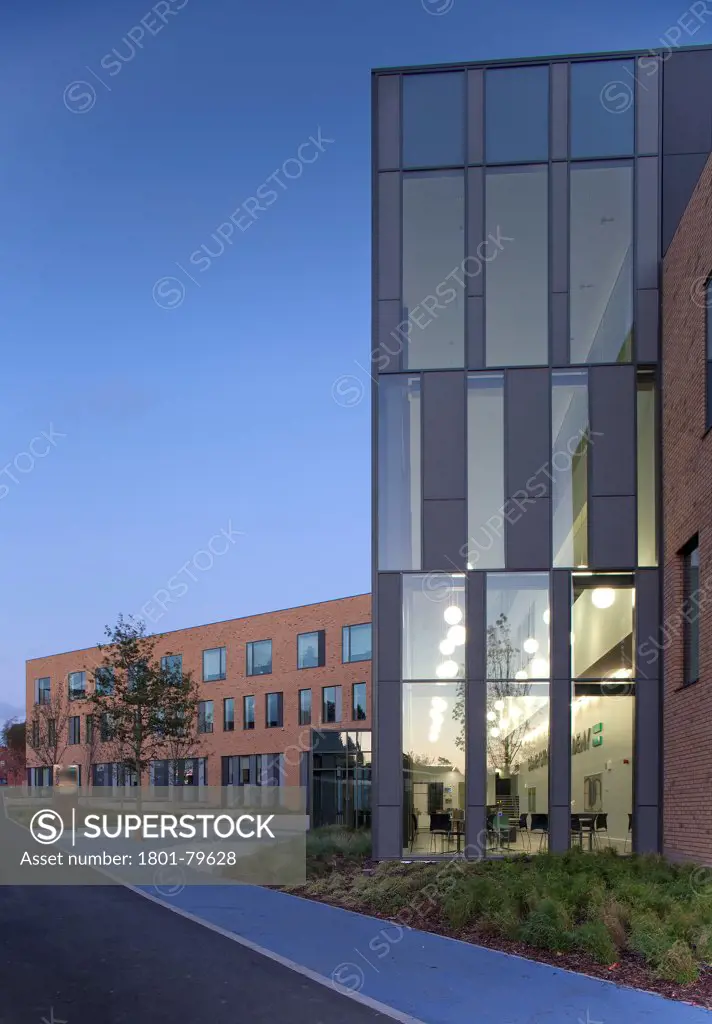 Sidney Stringer Academy, Coventry, Coventry, United Kingdom. Architect: Sheppard Robson , 2012. Perspective Of Glazed Facade At Dusk.