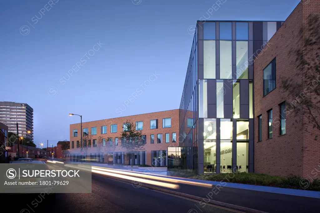 Sidney Stringer Academy, Coventry, Coventry, United Kingdom. Architect: Sheppard Robson , 2012. Perspective Of Glazed Facade And Street At Dusk.