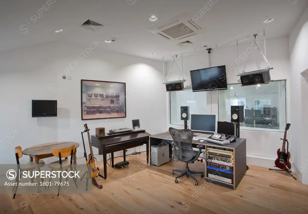 Soundtree Recording Studios, London, United Kingdom. Architect: Ben Adams Architects, 2011. Control Room With Mixing Desk And Guitar.