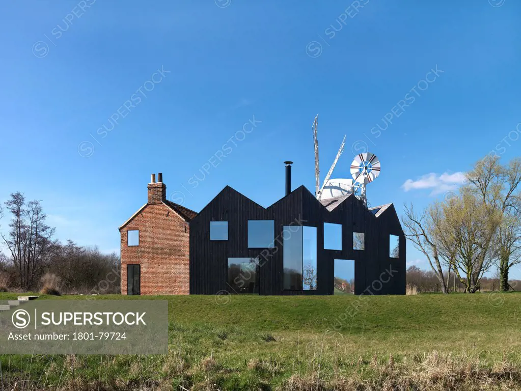 Hunsett Mill, Stalham, United Kingdom. Architect: Acme, 2010. Rear Elevation, Landscape.