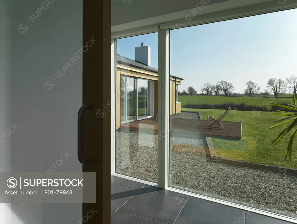 Woodfield House, Enfield, Ireland. Architect: Patrick Gilsenan Architect, 2011. View From Corridor Window To Garden.