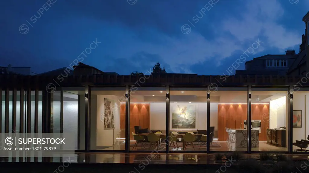 Private House, London, United Kingdom. Architect: Alan Higgs Architects, 2012. General Night View From Garden.